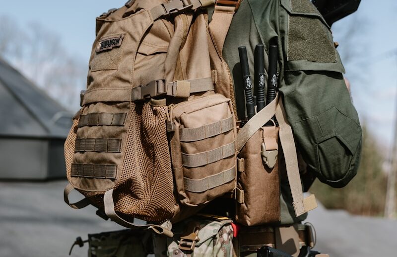 a man in camouflage with a backpack on his back