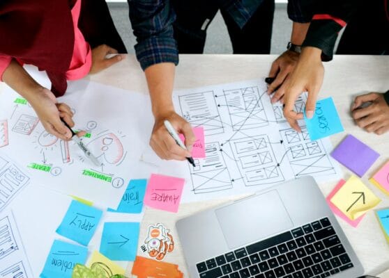 person writing on white paper