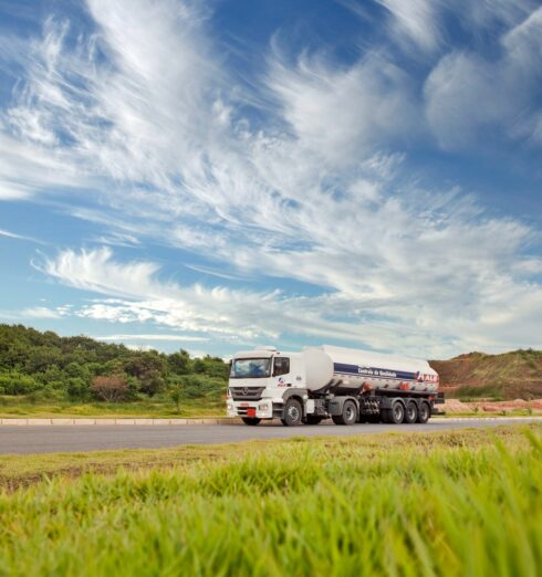 white and black storage truck on gray asphalt road